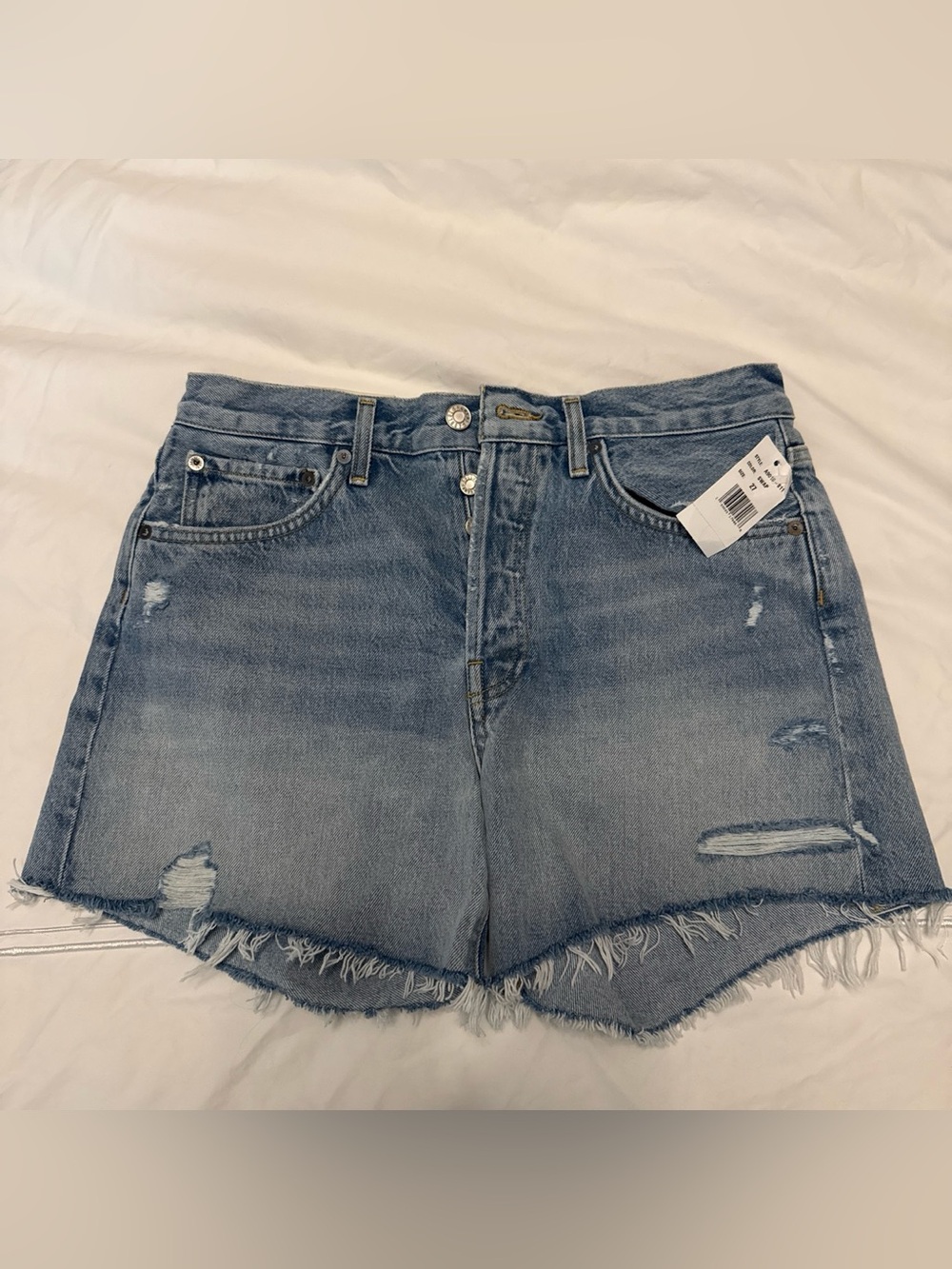 Agolde Parker Long Short in color Swap - Distressed Washed Denim Shorts